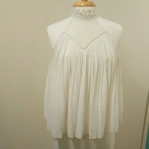 It girl white sleeveless blouse size XL.